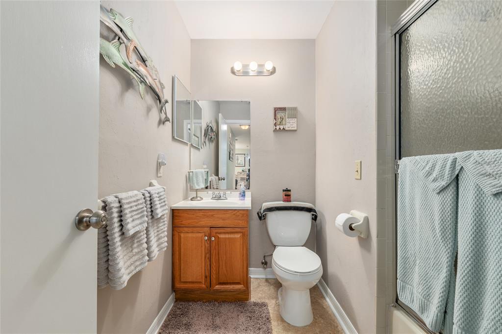 21373 Southwest Raintree Street Dunnellon, FL 34431 - Photo 25 of 39 a bathroom with a toilet sink and mirror