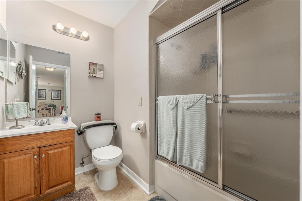 21373 Southwest Raintree Street Dunnellon, FL 34431 - Photo 26 of 39 a bathroom with a toilet sink and shower