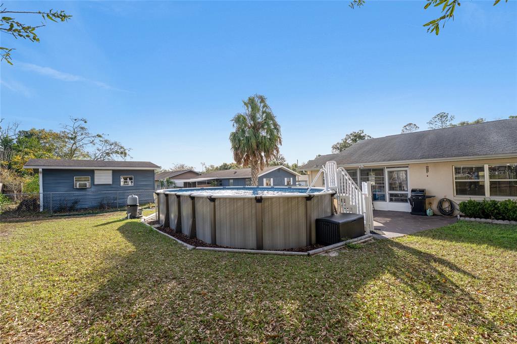 21373 Southwest Raintree Street Dunnellon, FL 34431 - Photo 3 of 39 a view of a house with backyard and sitting area
