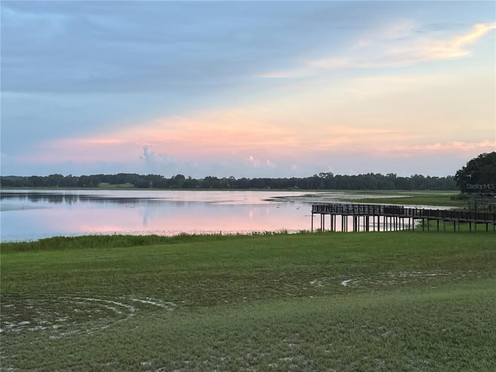 21373 Southwest Raintree Street Dunnellon, FL 34431 - Photo 35 of 39 a view of a lake with houses in the back