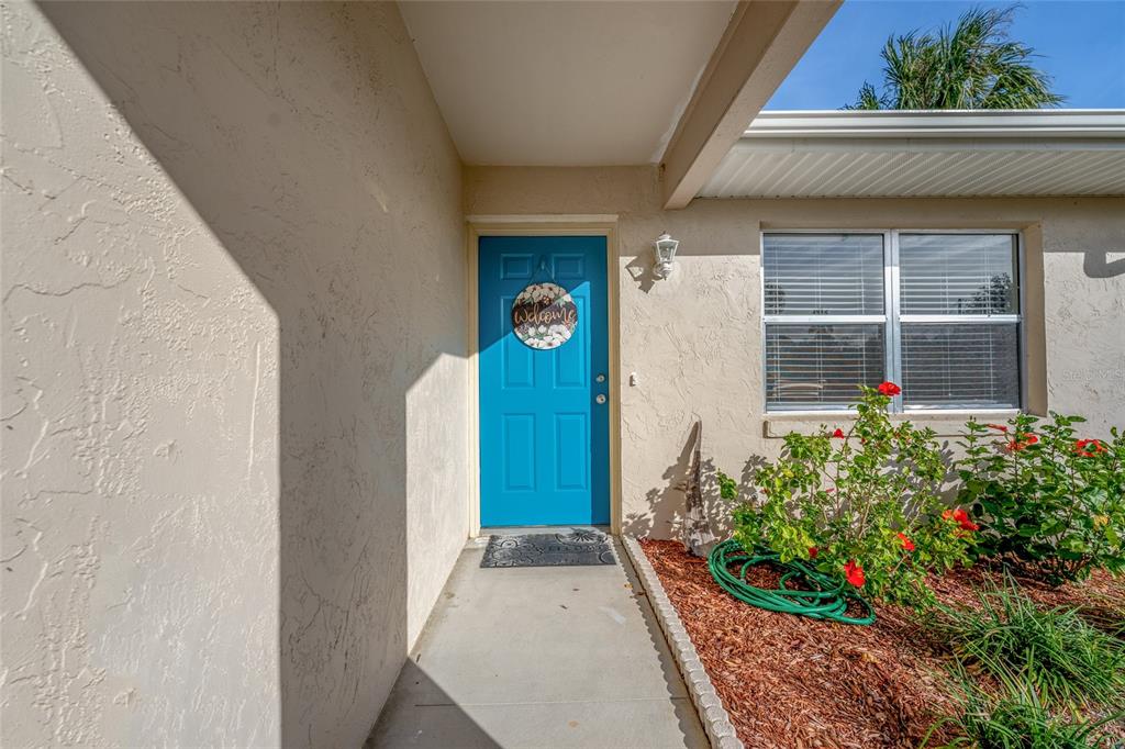 21373 Southwest Raintree Street Dunnellon, FL 34431 - Photo 8 of 39 a front view of a house with a yard