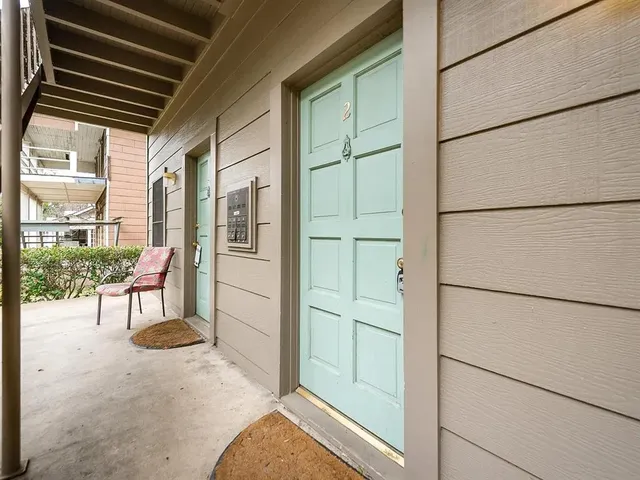a view of a hallway with a glass door