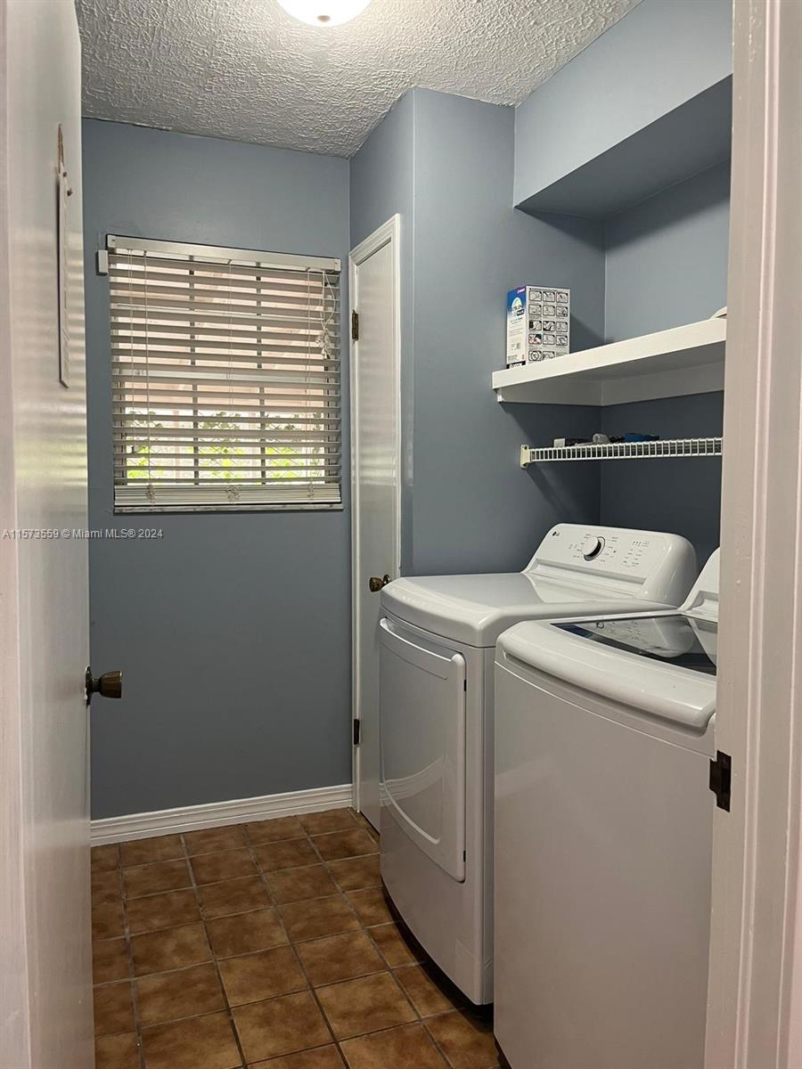 Confederate Point Jacksonville, FL 32210 - Photo 18 of 60 a utility room with dryer and washer