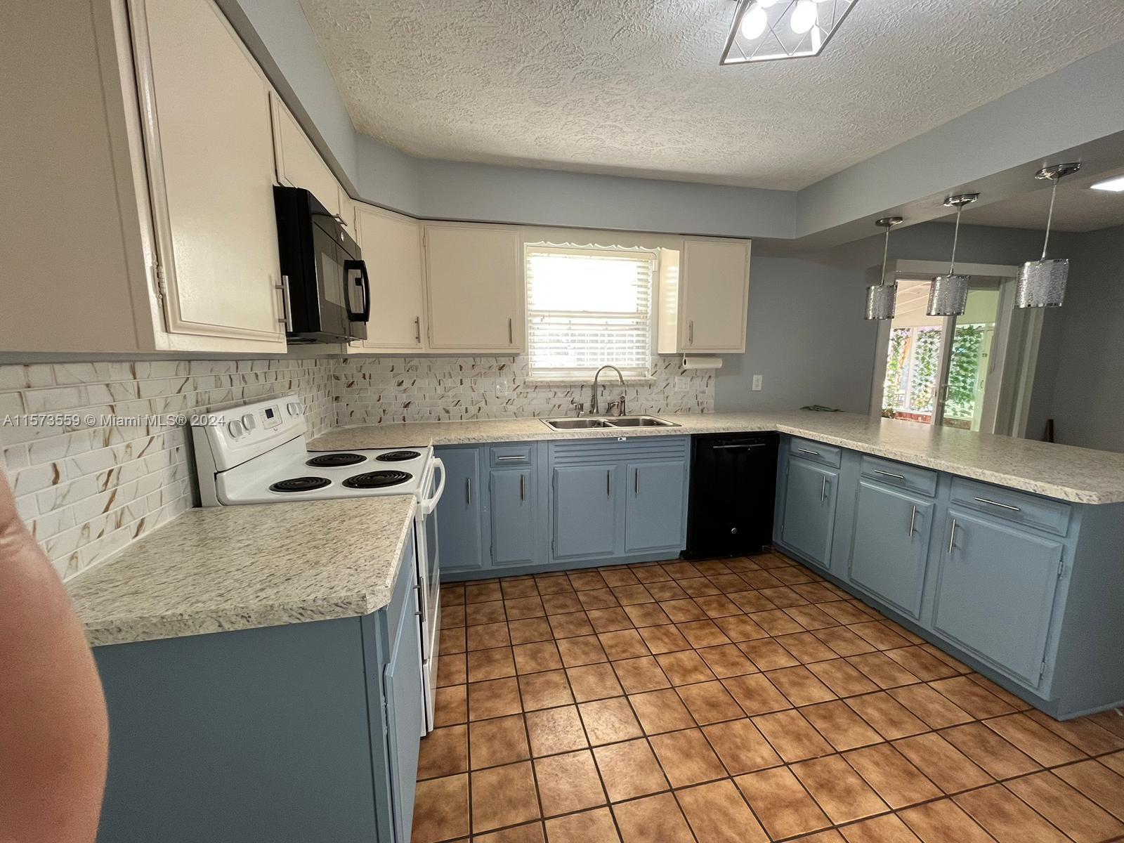 Confederate Point Jacksonville, FL 32210 - Photo 21 of 60 a kitchen with stainless steel appliances granite countertop a sink stove and cabinets