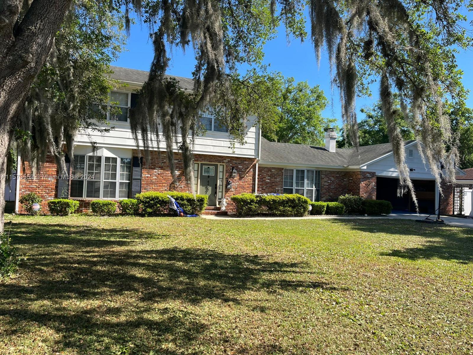 Confederate Point Jacksonville, FL 32210 - Photo 37 of 60 a front view of a house with a yard