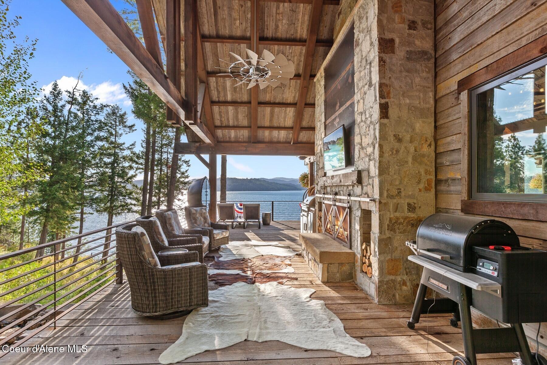 20890 South Inspiration Trail Harrison, ID 83833 - Photo 15 of 67 Wrap side deck with Stone FP