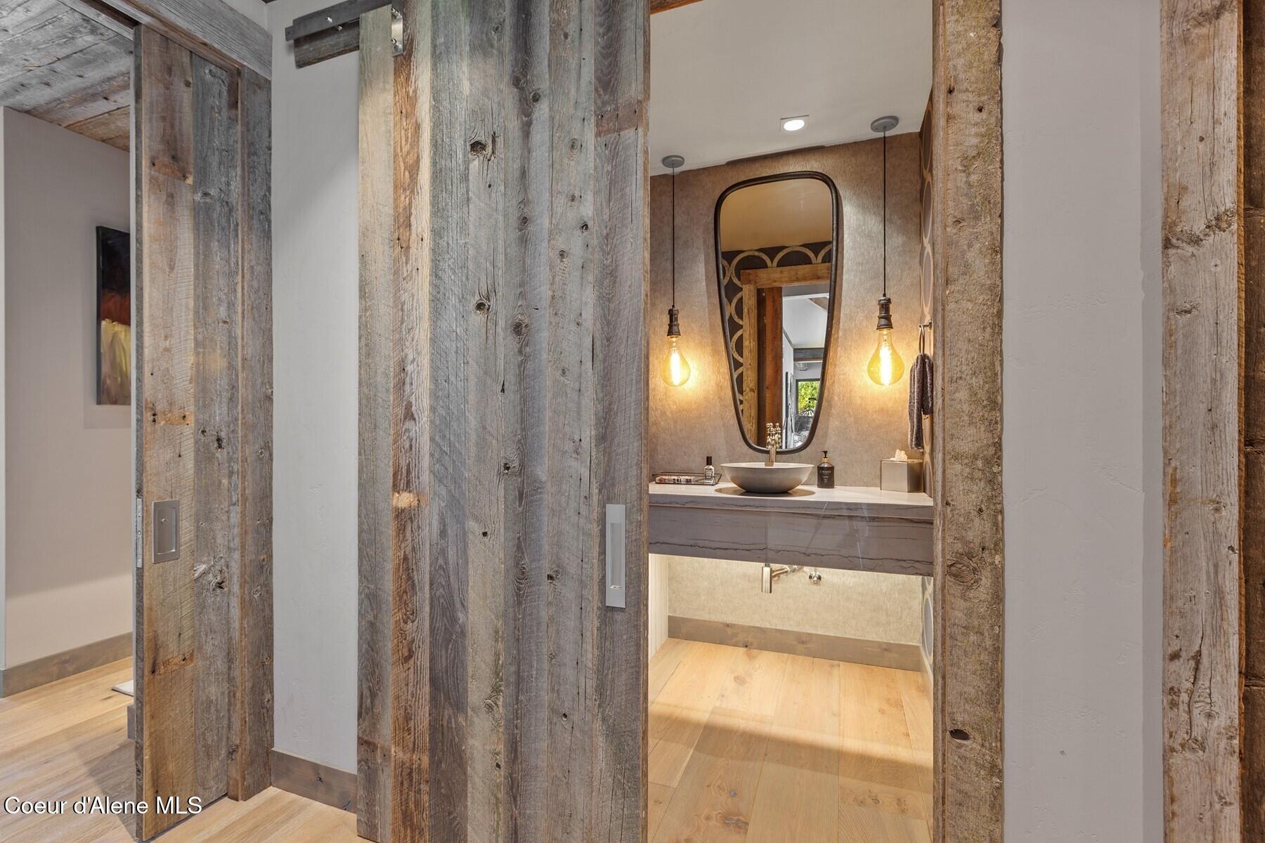 20890 South Inspiration Trail Harrison, ID 83833 - Photo 51 of 67 Barn door to the powder bath