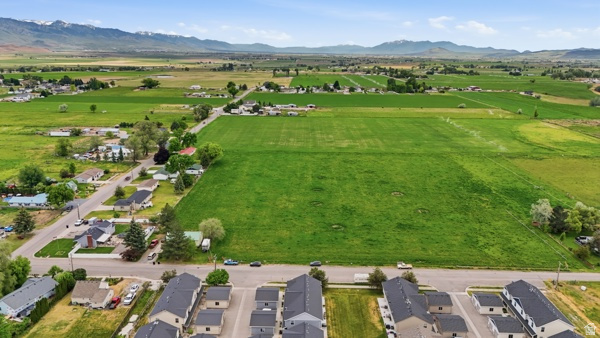 391 South 440th Street West Preston, ID 83263 - Photo 25 of 28 Expansive green fields surrounded by distant mountains