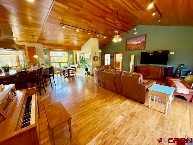 a view of a dining table and chairs in the patio