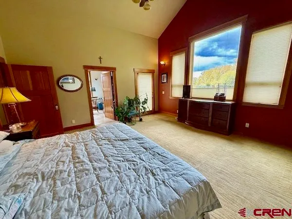 a bedroom with a bed and a table in it