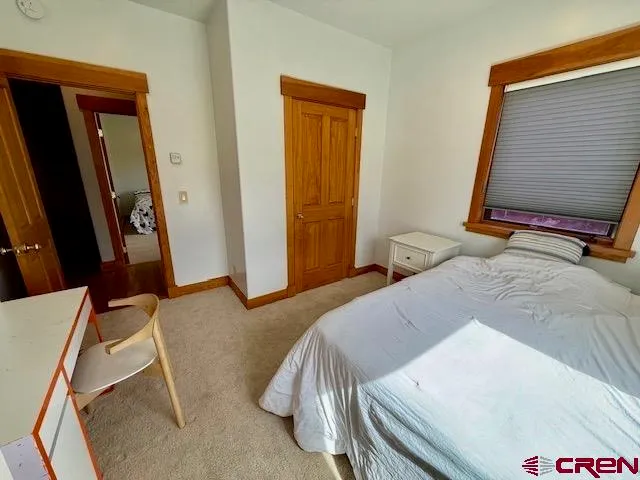 a view of an empty room and a window