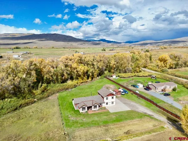 a view of a swimming pool with an ocean in the background