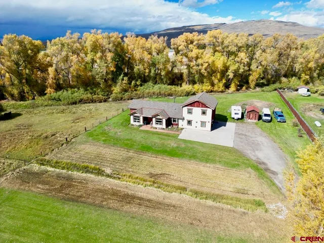 a view of house with outdoor space and sitting area
