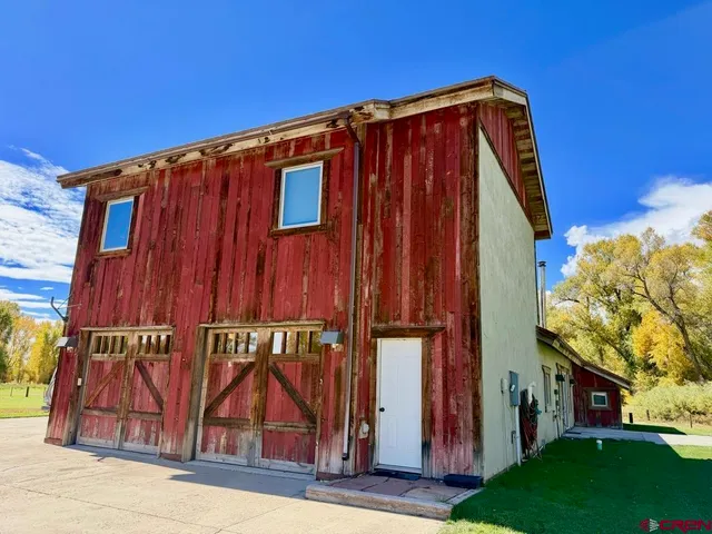 a view of a swimming pool with an outdoor space and seating area