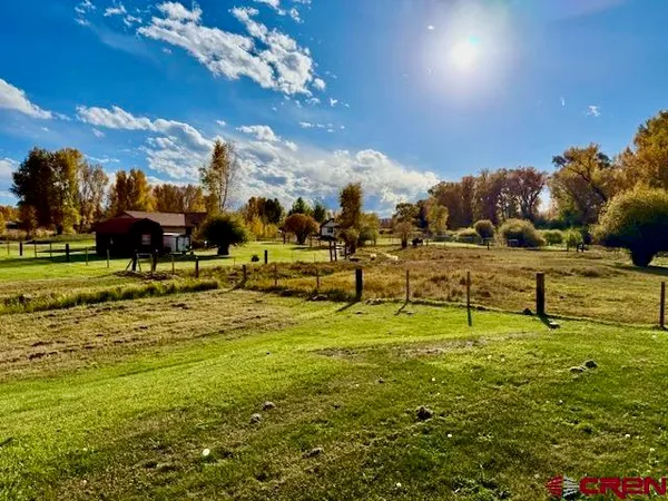a view of a chairs and table in a patio