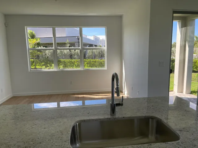 a kitchen with a sink and a window