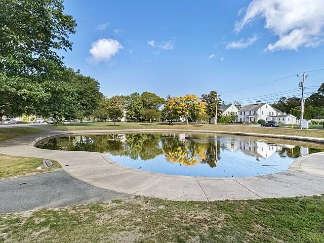 a view of swimming pool with a yard