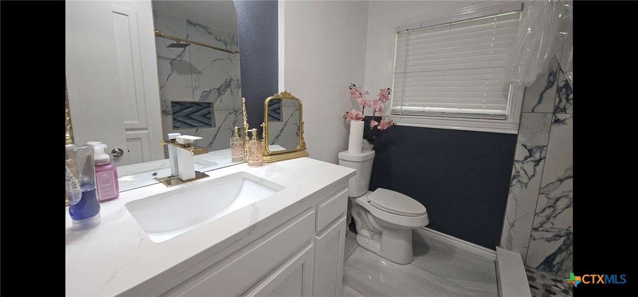1901 South 33rd Street Temple, TX 76504 - Photo 14 of 20 Fully remodeled Bathroom with walk in shower. With Porcelain floors.