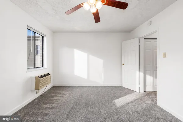 a view of an empty room with a window