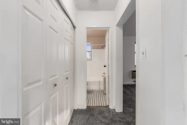 a kitchen with a sink and a refrigerator