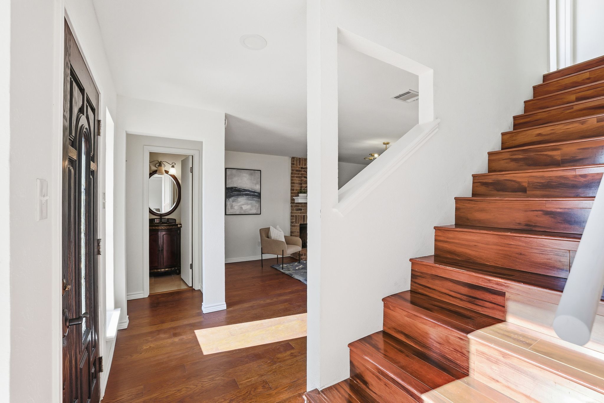 13004 Esplanade Street Austin, TX 78727 - Photo 26 of 36 Stairway with wood finished floors - ALL BEDROOMS ARE UP