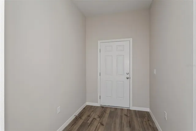 a view of room with hardwood floor