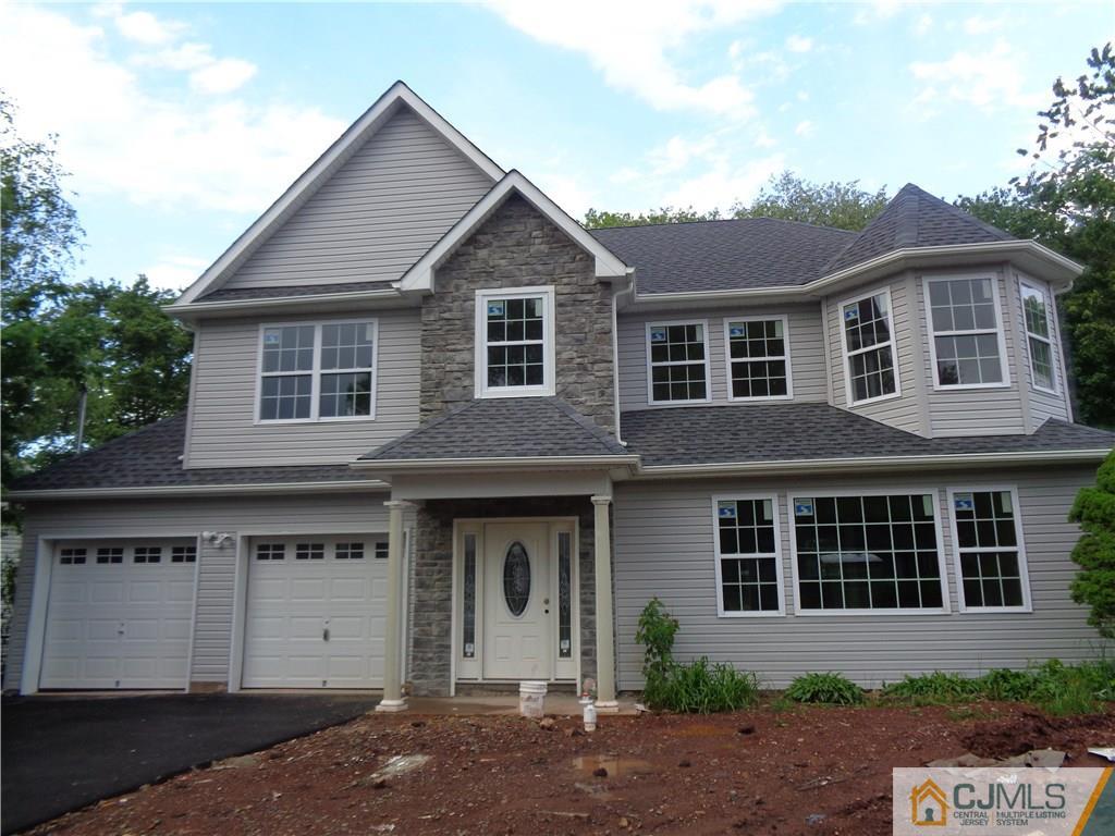 15 Altamont Road Edison, NJ 08817 - Photo 1 of 7 a front view of a house with a yard and garage