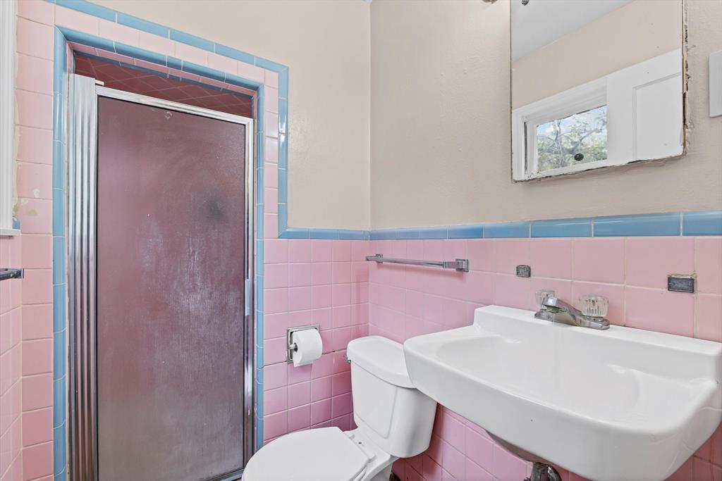 1208 Sunset Street Waco, TX 76710 - Photo 13 of 24 a bathroom with a sink a toilet and shower