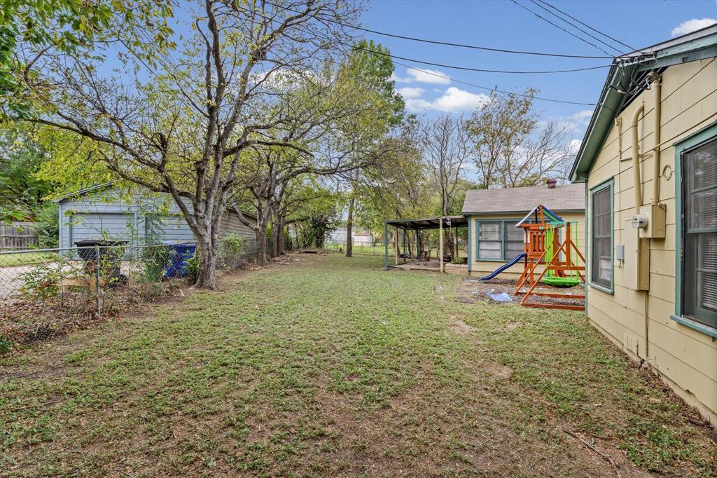 1208 Sunset Street Waco, TX 76710 - Photo 20 of 24 a view of a house with a back yard