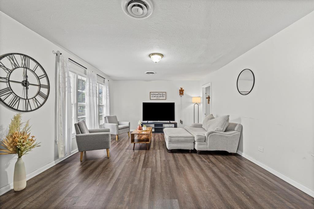1208 Sunset Street Waco, TX 76710 - Photo 5 of 24 a living room with furniture and a flat screen tv