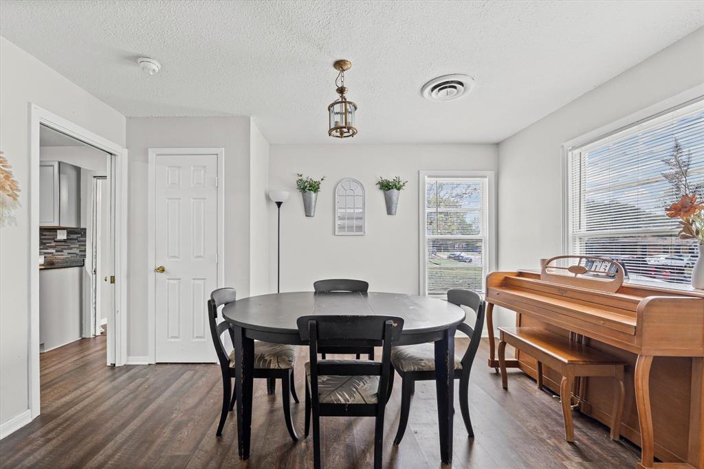 1208 Sunset Street Waco, TX 76710 - Photo 7 of 24 a view of a dining room with furniture and wooden floor