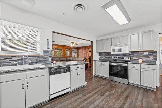 a view of a house with a back yard