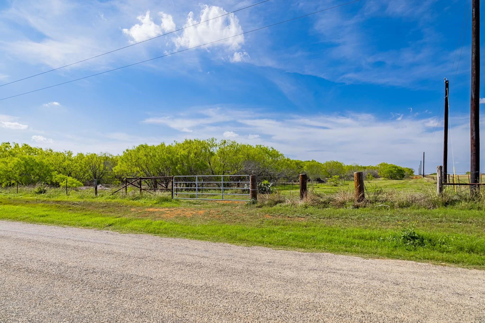 0 Bluntzer Road Jourdanton, TX 78026 - Photo 20 of 30 a view of a golf course with a lake view