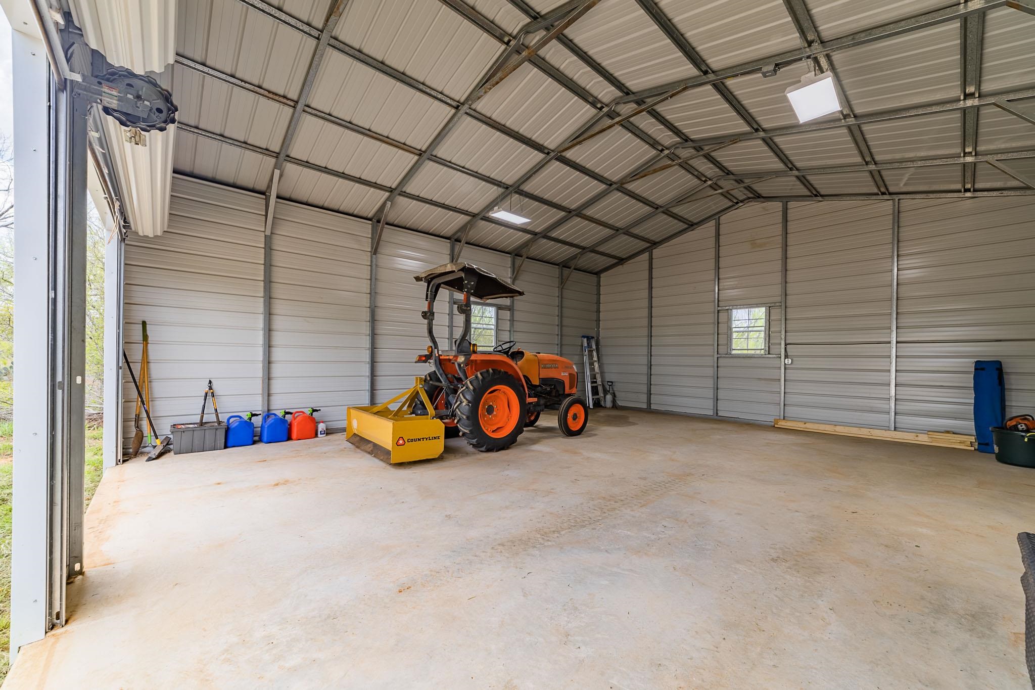 0 Bluntzer Road Jourdanton, TX 78026 - Photo 5 of 30 a view of a garage with parked cars