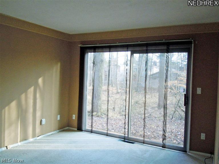 17413 Ridge Creek Road Strongsville, OH 44136 - Photo 14 of 18 Master Bedroom Has Access To Backyard & Carpet Flooring