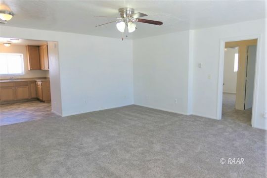 229 North Helena Street Ridgecrest, CA 93555 - Photo 4 of 32 a view of an empty room with a window