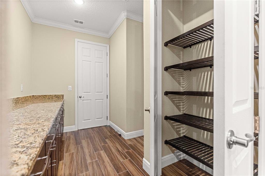 9460 Southwest 86th Place Ocala, FL 34481 - Photo 28 of 86 a view of a hallway with wooden floor and staircase