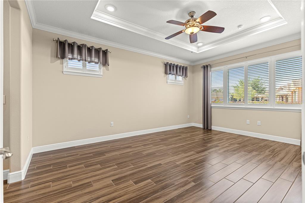 9460 Southwest 86th Place Ocala, FL 34481 - Photo 33 of 86 a view of an empty room with window and wooden floor
