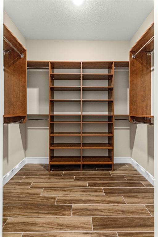 9460 Southwest 86th Place Ocala, FL 34481 - Photo 38 of 86 a view of walk in closet with empty racks