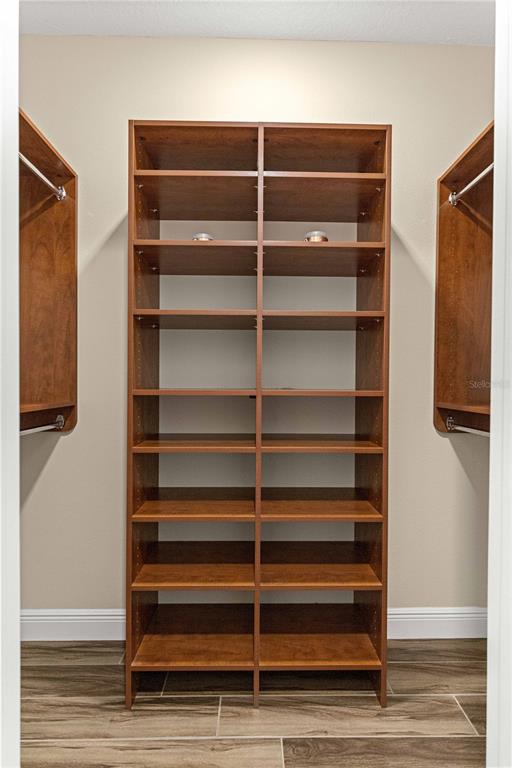 9460 Southwest 86th Place Ocala, FL 34481 - Photo 39 of 86 a view of walk in closet with empty racks