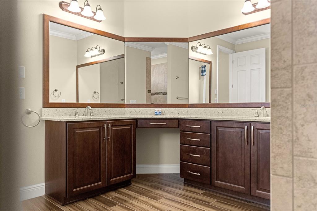 9460 Southwest 86th Place Ocala, FL 34481 - Photo 42 of 86 a bathroom with a granite countertop sink and a mirror