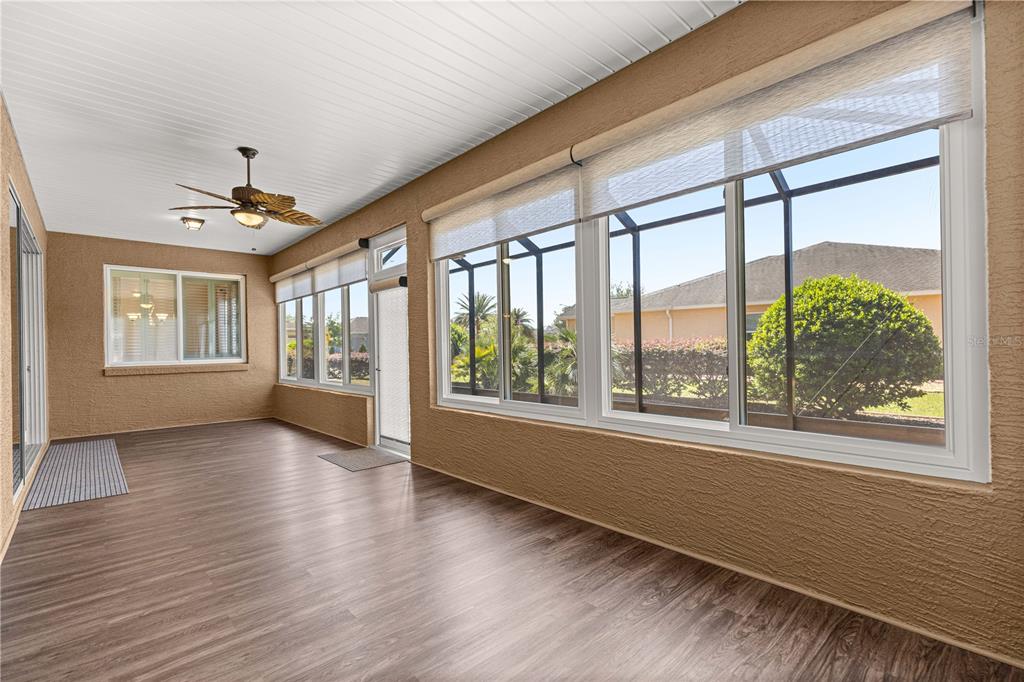 9460 Southwest 86th Place Ocala, FL 34481 - Photo 58 of 86 a view of an empty room with a window and wooden floor