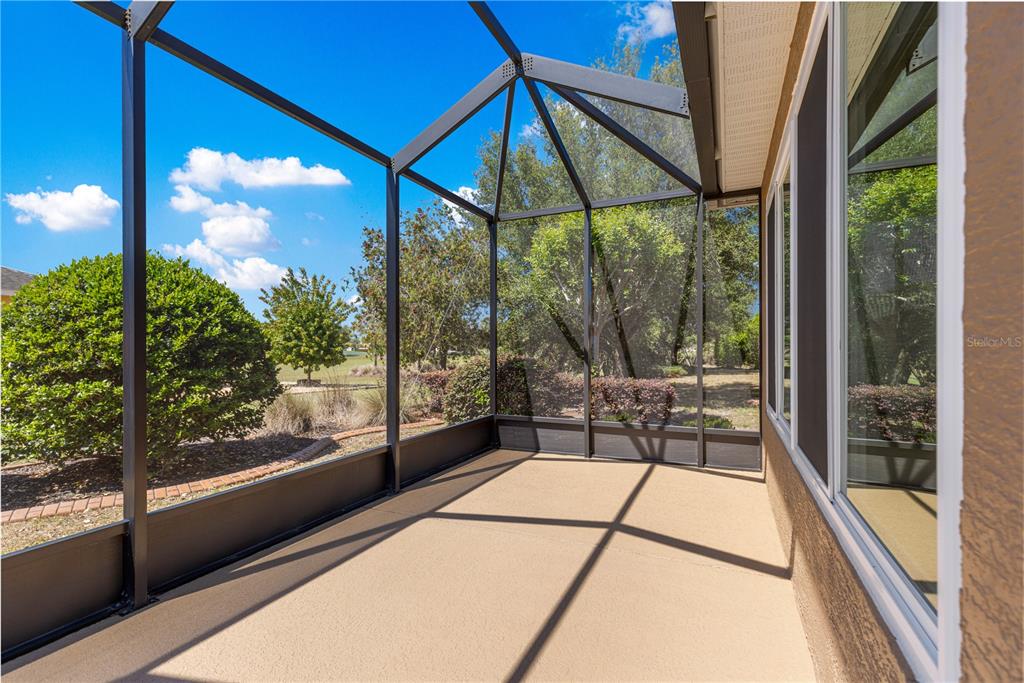 9460 Southwest 86th Place Ocala, FL 34481 - Photo 61 of 86 a view of a glass door with a floor to ceiling window
