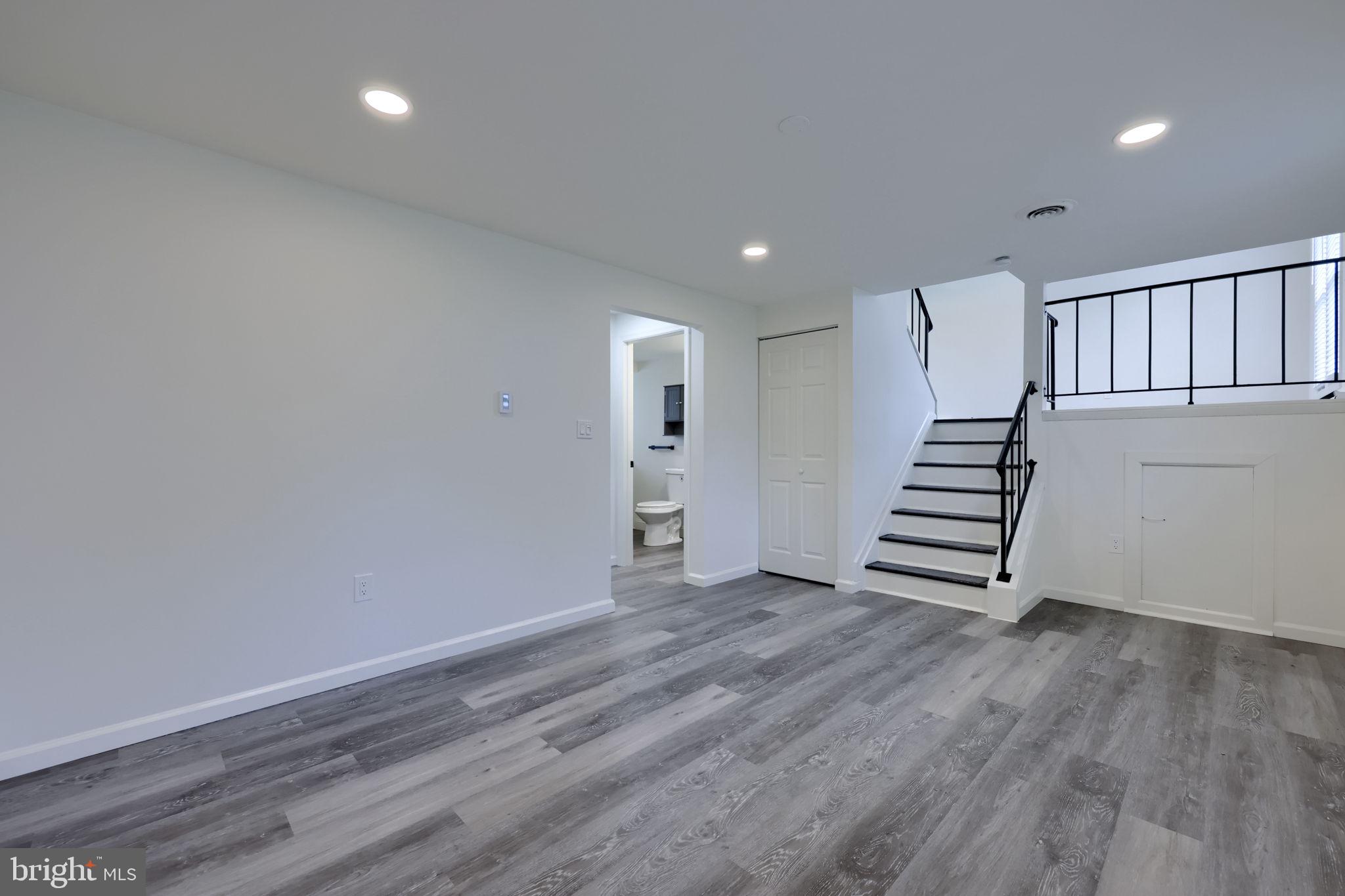106 Warren Way Lancaster, PA 17601 - Photo 13 of 32 an empty room with wooden floor and white walls