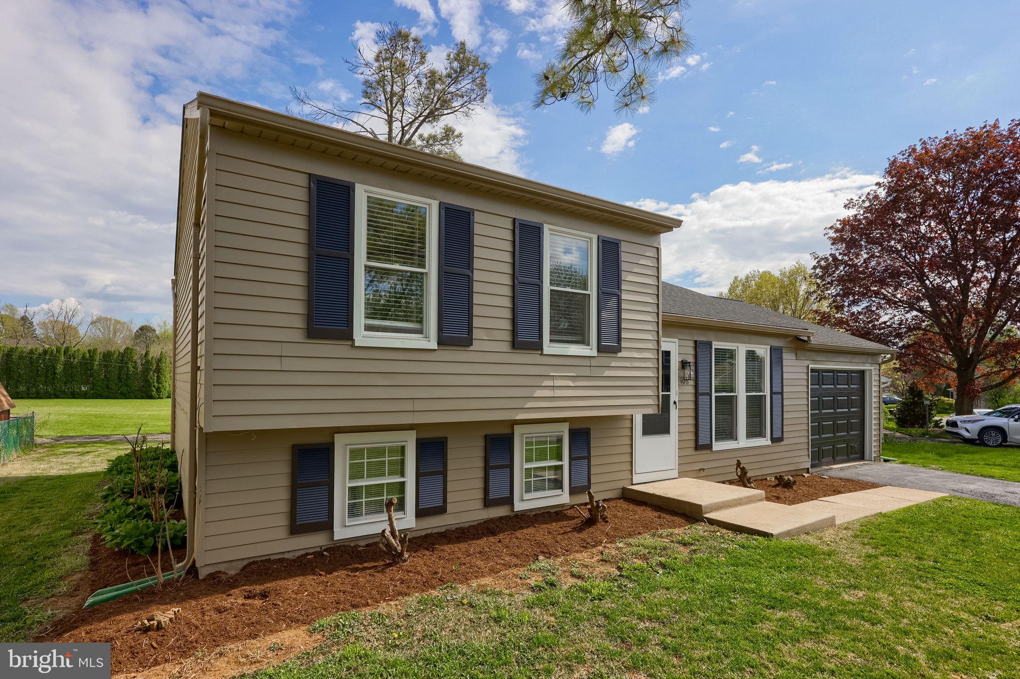 106 Warren Way Lancaster, PA 17601 - Photo 2 of 32 a view of a house with a backyard and a tree