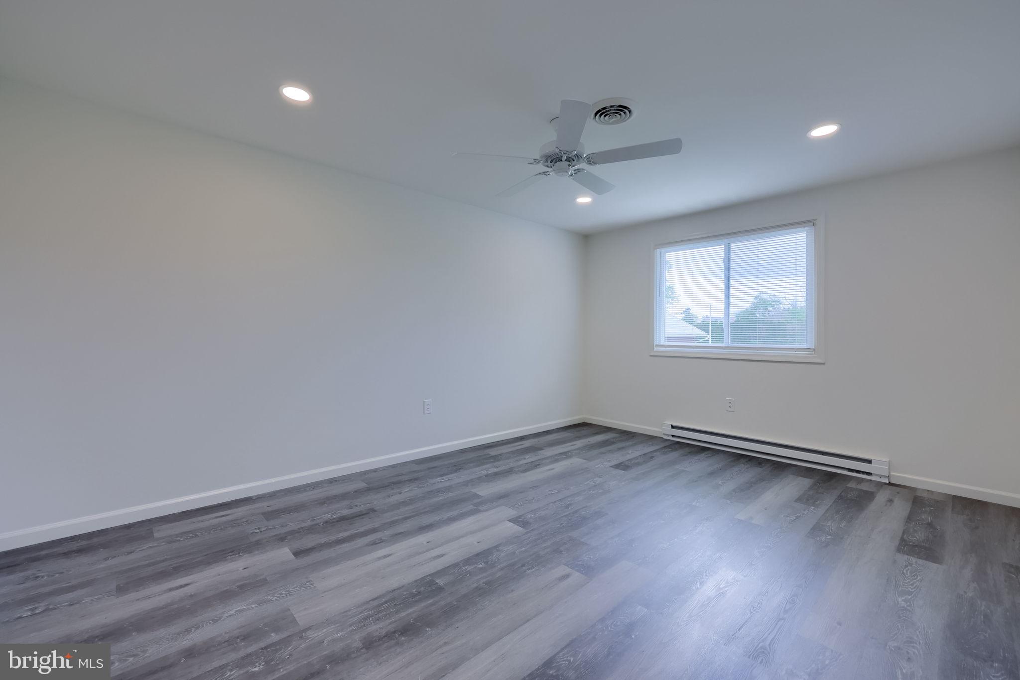 106 Warren Way Lancaster, PA 17601 - Photo 24 of 32 wooden floor in an empty room with a window