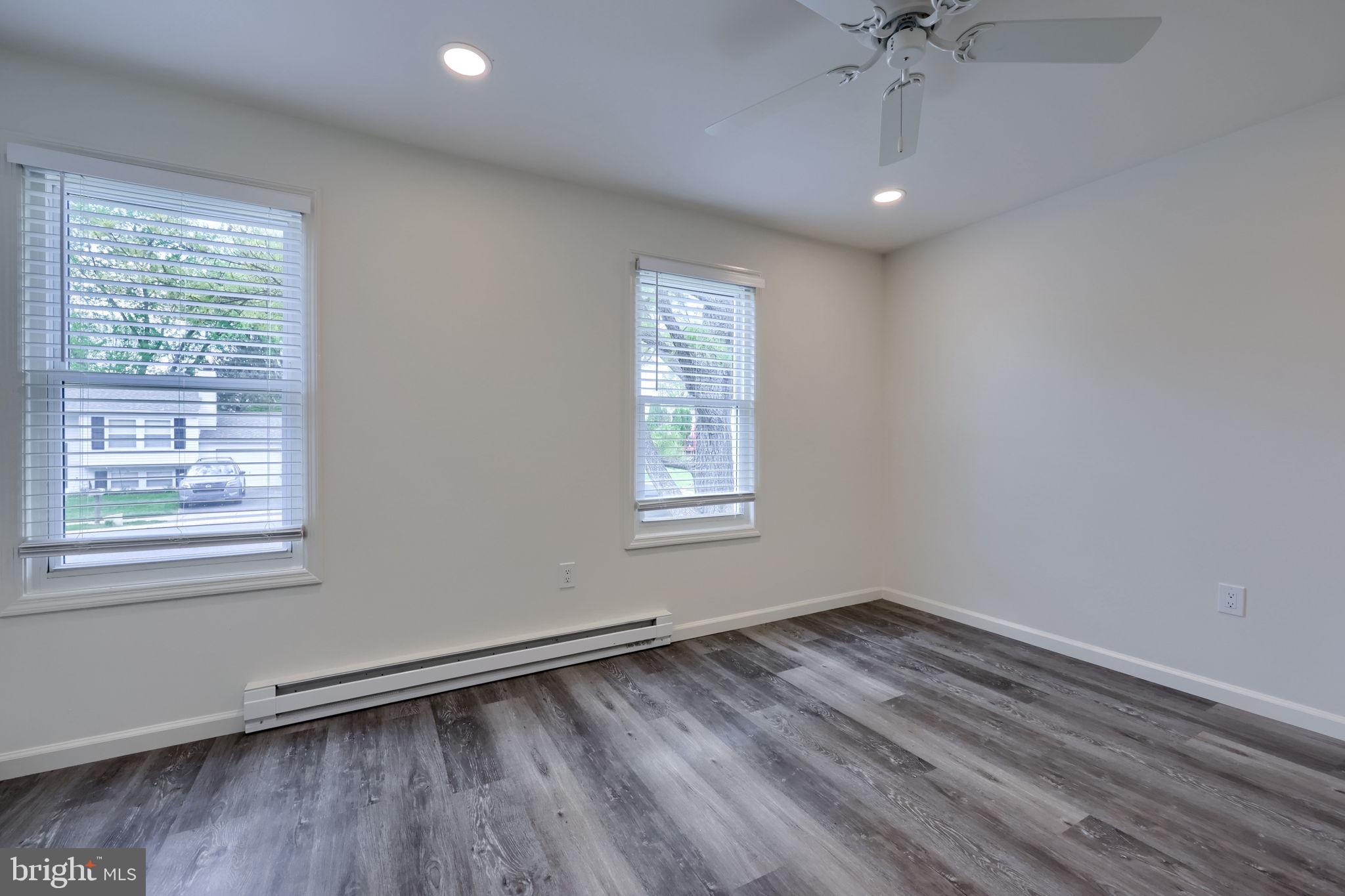 106 Warren Way Lancaster, PA 17601 - Photo 27 of 32 a view of empty room with wooden floor and fan
