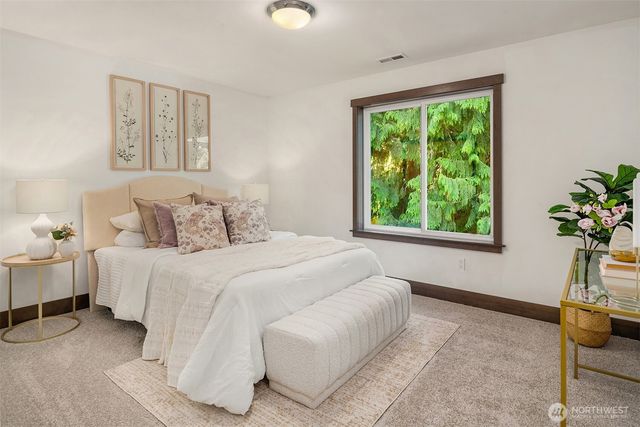 a bedroom with bed and a window