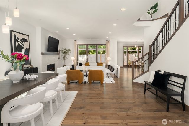 a living room with fireplace furniture and a flat screen tv