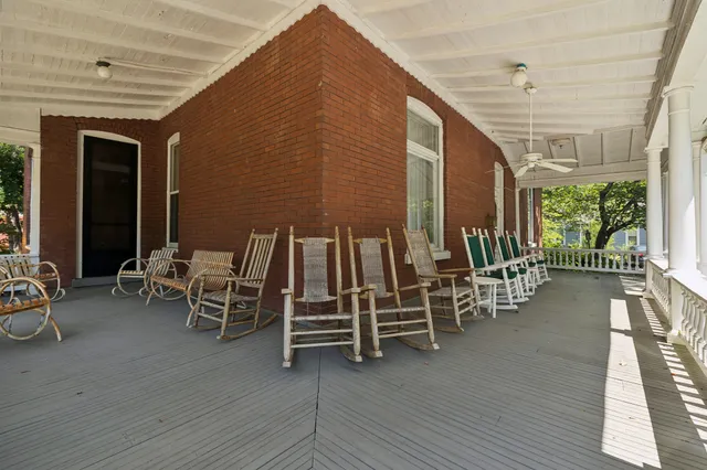 a view of a livingroom with furniture and a fireplace